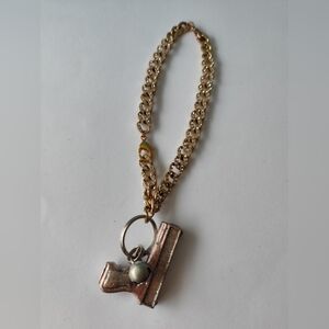 3/$25💙Gold Chain with Gun Pendant